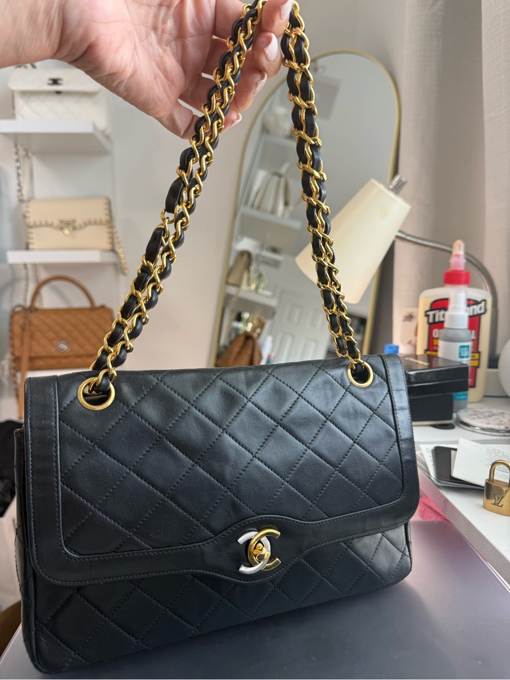 CHANEL Black Quilted Leather Shoulder Bag with Gold Chain Strap